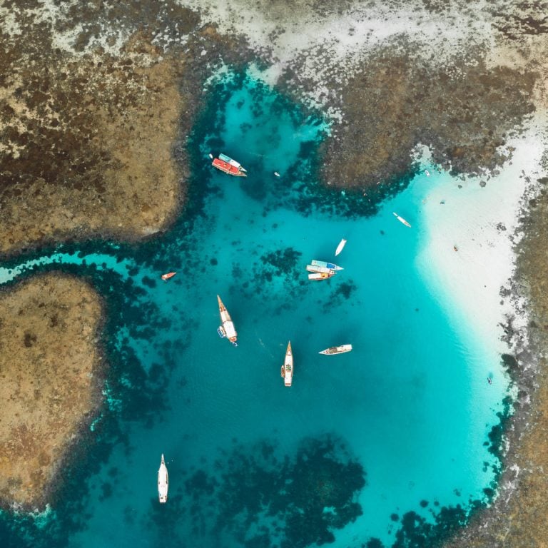 Two scuba divers near the reef at Siaba Besar dive site