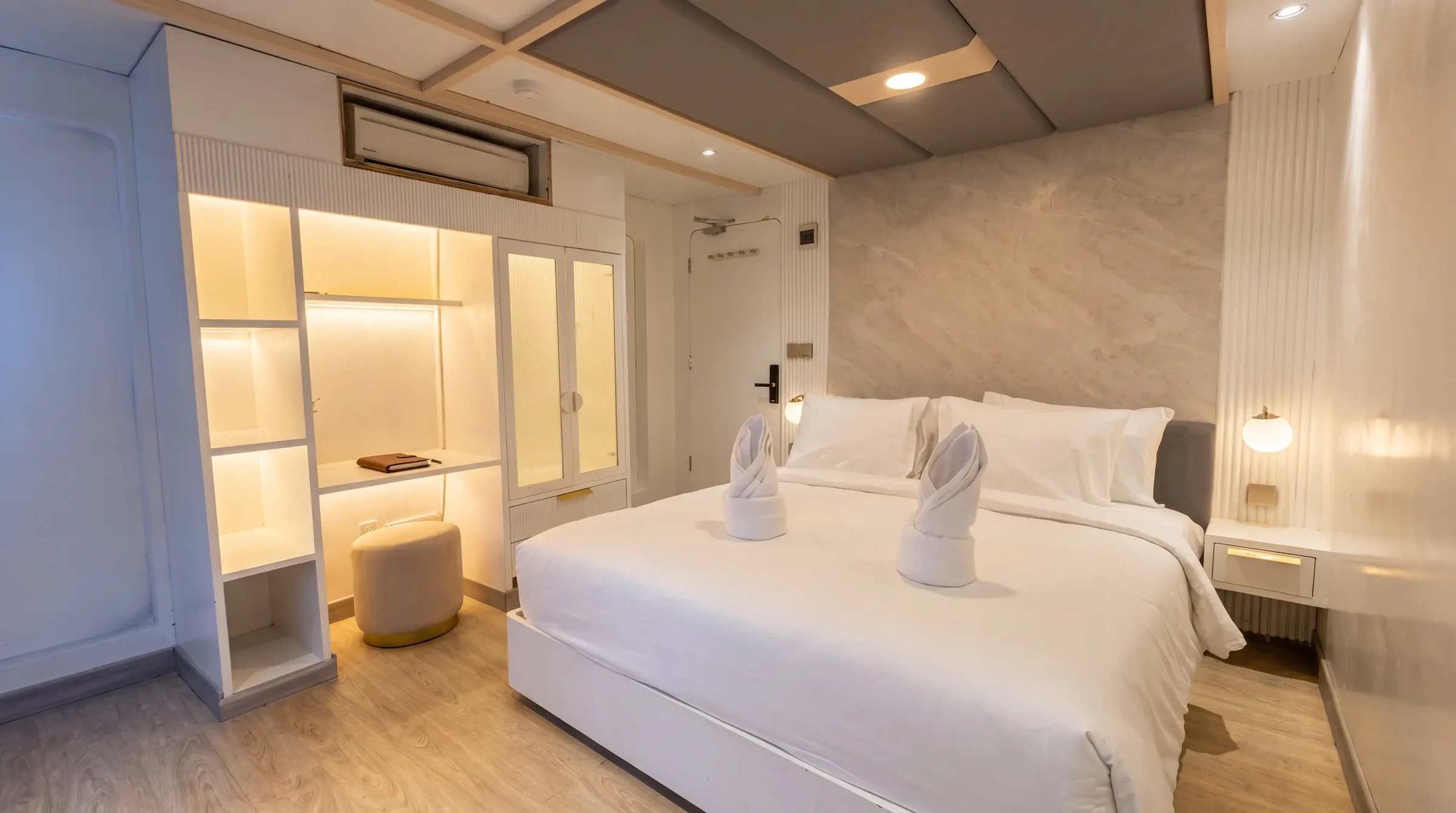 Master Suite cabin on Lasha Phinisi Cruise with double bed and private balcony
